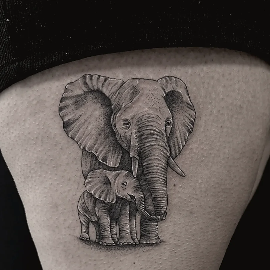Realism tattoo of an elephant mother and calf in black and grey
