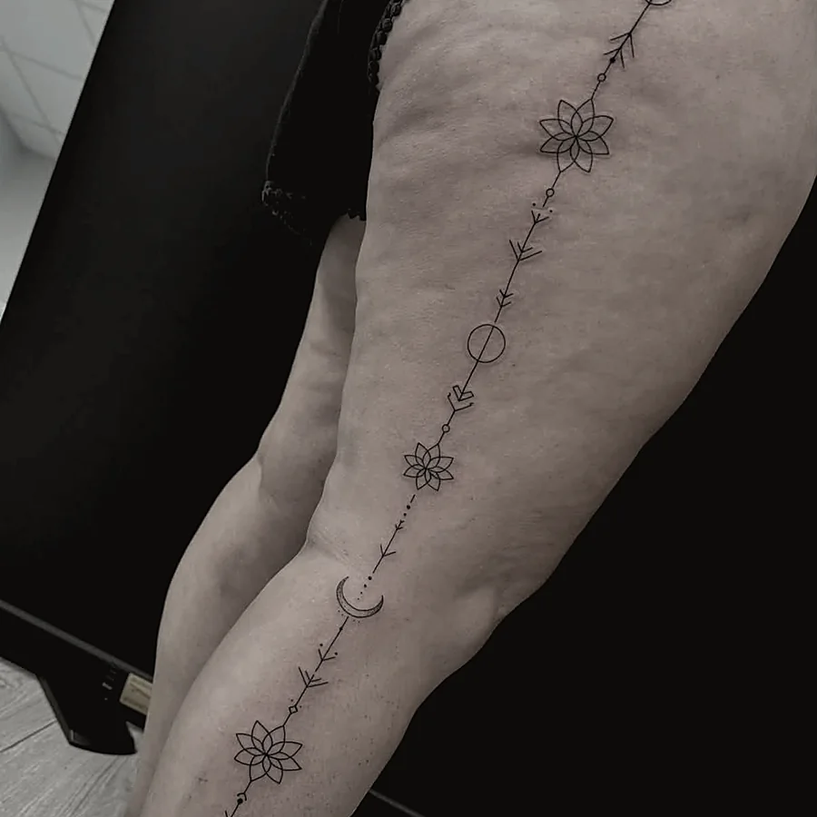 Fine-line ornamental tattoo design in black ink
