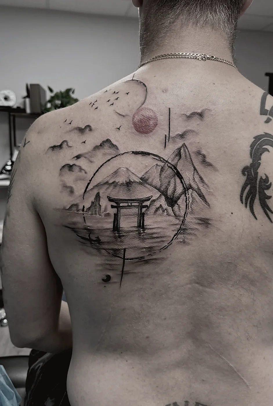 Japanese-style back piece tattoo in black and grey, full coverage