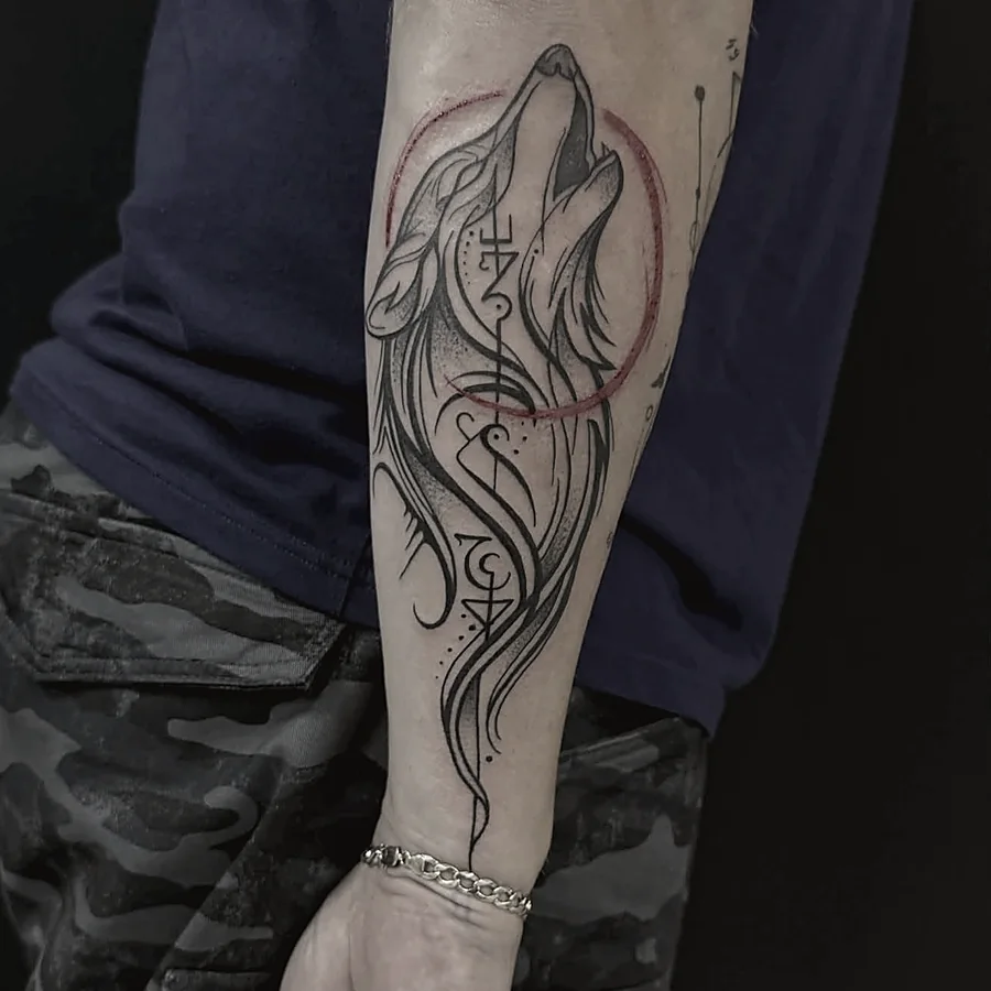 Sketch-style wolf tattoo in black and grey